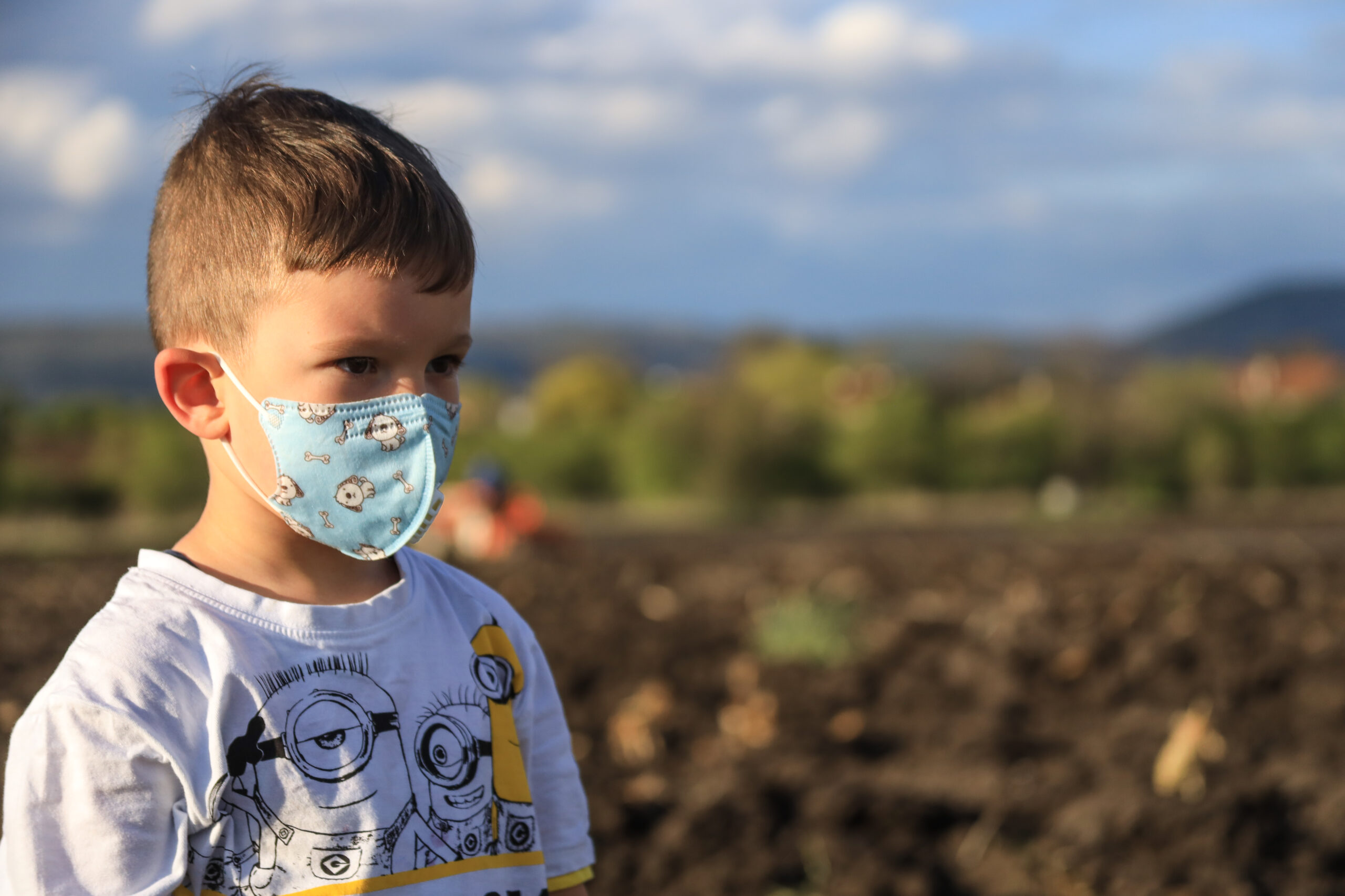 A boy wearing mask outdoor